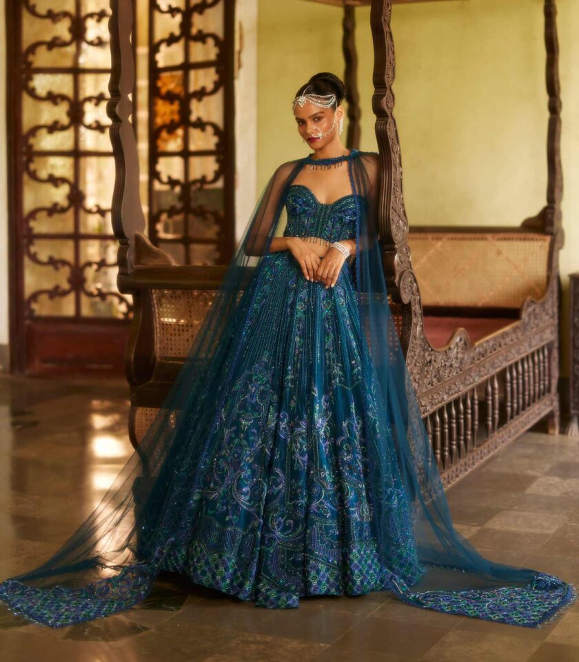 Lehenga styled with corset top & detachable wings